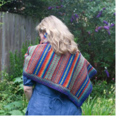 Striped colorwork shawl. Hard to tell from the photos if it’s rectangular or triangular.