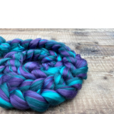 Bright aqua, deep aqua and medium purple braided spinning fiber.