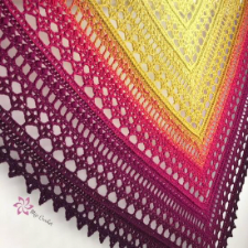 Triangular lace shawl knit in chevron along the spine.