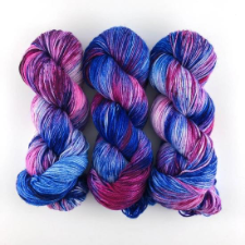 Variegated skeins in brilliant blue and deep pinks and reds.