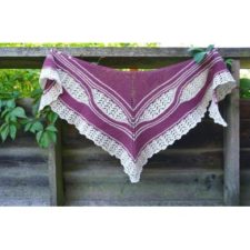 Triangular shawl with lace edge and lace panels added using shortrows.