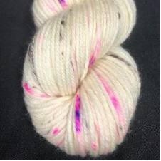 Cream color yarn with bright and dark streaks of a couple of inches long.