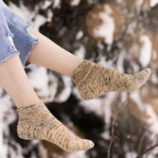 Shortie socks feature a subtle and beautiful textured pattern around the leg and down the top of the foot.