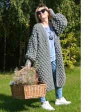 Bubble texture oversize cardigan with full sleeves reaches to halfway down the wearer’s calf.