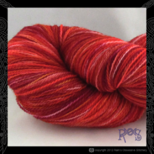 Tonal lace yarn in flame colors.