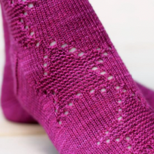 Socks with texture and lace stars down the leg and top of the foot.