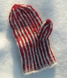 Photo of a brioche mitten atop snow