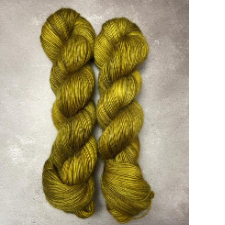 Greenish gold tonal yarn with just a hint of mohair.