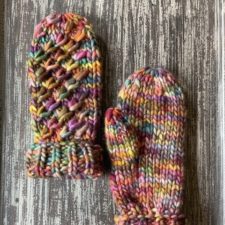 Mittens with traveling one-stitch cables all on the same diagonal.