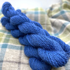 Bright blue woolen spun Shetland yarn.