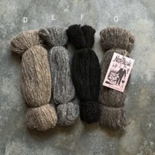 Four natural skeins in black, brown, gray and tan.