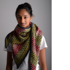 Teen wears colorwork shawl in zigzag pattern created with slipstitches.