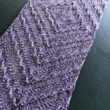 Scarf with subtle ruffled texture in geometric pattern