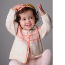 Toddler wears long-sleeve cardigan with stripes and buttons that extend to mid chest, then plain fabric and open to the hip.