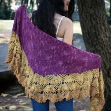 Dramatic textured shawl with luxurious layered lace bottom edge.