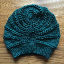 Stocking cap with non-concentric circular designs.