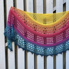 Semi-circular openwork shawl in four textured crescents.