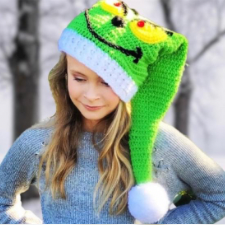 Green stocking cap with the Grinch’s face on it. Cap has contrasting ribbed brim and pompom.