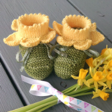 Baby booties where the cuff looks like the cup of a daffodil, with petals extending from it. Unbelievably cute.