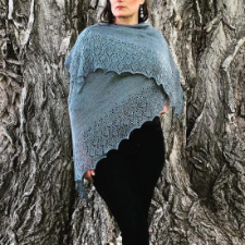 Large laceweight triangular shawl with wide lace border.
