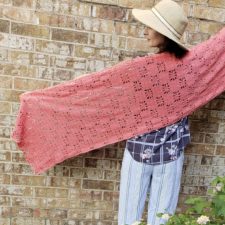 Rectangular wrap, about 18 by 70 inches, with squares of openwork throughout.