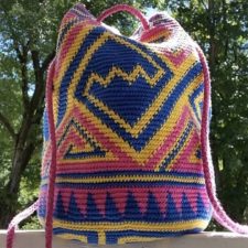 Multicolor geometric drawstring tote.