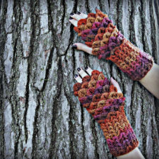 Fingerless mitts with overlapping “dragon scales” around the hands.