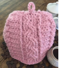 Cabled crochet teapot cozy.