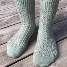 Socks with tiny, intricate lace and cables throughout.