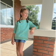 Child’s pullover with crew neck and sleeves just below the elbow.