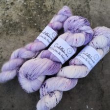 Laceweight skeins in gentle flower shades.