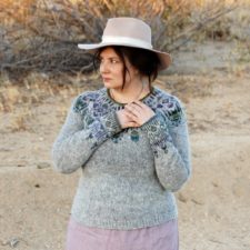 Pullover with delicate, chandelier-like colorwork on yoke and at wrists.