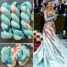 Three skeins of mint yarn with pink, white and deeper teal highlights, along with a celebrity on a red carpet in a matching dress.