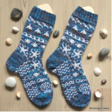 Colorwork socks with sea creatures on them.