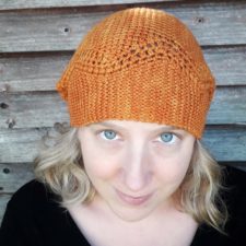 Tunisian crochet hat with wavy border dividing the brim from the crown.