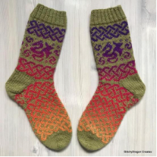 Colorwork socks with dragons and elaborate Celtic knots.