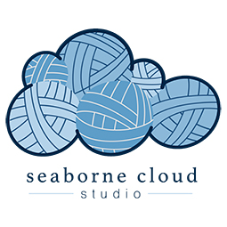Logo is yarn balls, forming a cloud