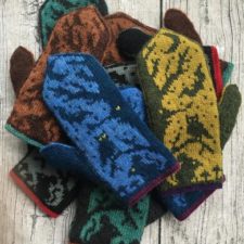 Colorwork mittens with owl, bat and mouse under a tree and crescent moon.