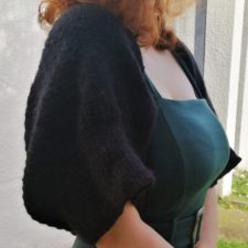 Shrug with full, elbow-length sleeves.