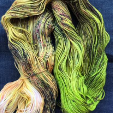 Variegated yarn that is half bright green and half murkier variegated complementary colors.