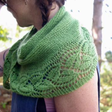 Crescent shawl in one color with leafy lace bottom edge.