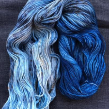 Variegated yarn that is half bright blue and half pastel variegated blues.