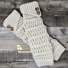 Textured leg warmers with angled foldover tops, decorated with two buttons each.