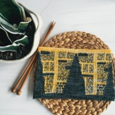 Two-color cowl that has angled beams of light that reveal newspaper columns of print.
