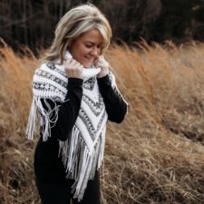 Triangular crocheted poncho with a wide turtleneck.