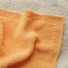 Simple baby blanket with contrasting texture on the edge.