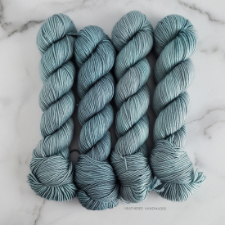 Tonal greyed aqua skeins.