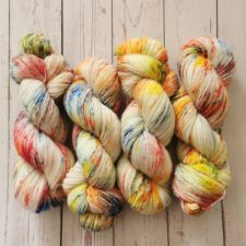 Mainly undyed yarn with splashes of bright colors.