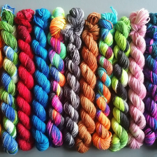 Minis, mainly variegated, with about a dozen colorways based on celestial phenomena.