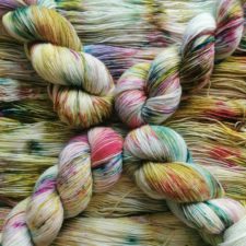 Mainly undyed yarn with bright splashes.